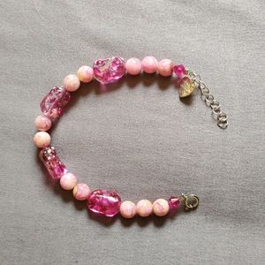 Handcrafted adjustable size beaded bracelet. Pretty pinks!